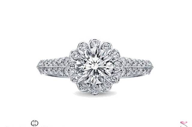 Christopher Designs Fancy Round Halo Diamond Engagement Semi-Mount. The Halo is Scalloped creating a flower design that would Surround your center diamond. The ring is crafted in 18K white gold set with 54 diamonds totaling 0.57 carats on the Halo & the sides. This ring would fit a 1.00 ct. round diamond. Also available for smaller or larger center stones, and your choice of metal, yellow or white 18K gold or Platinum. Center diamond not included, Please see our large Diamond Inventory and select the one that's right for you.
Christopher Designs, a unique selection available exclusively in Hawaii at Solitaire Jewelers