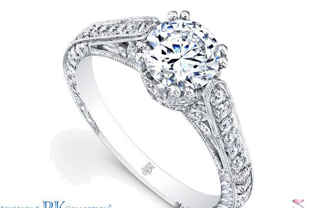 This elegant designed Beverley K semi mount engagement ring features a lovely gallery design with 0.35 carat pavé diamonds down the shank and elegant side engraving.