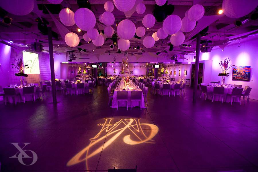 Pink uplighting and monogram projection