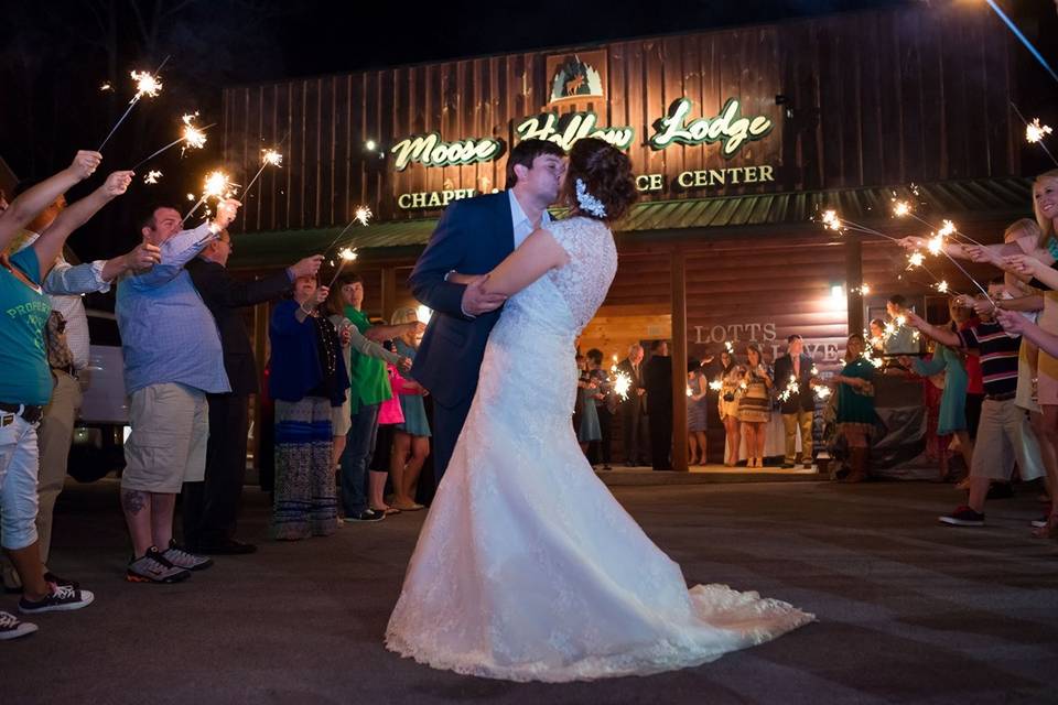 Guests hold up sparklers