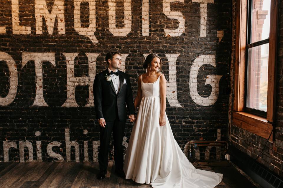 Couple by historic wall