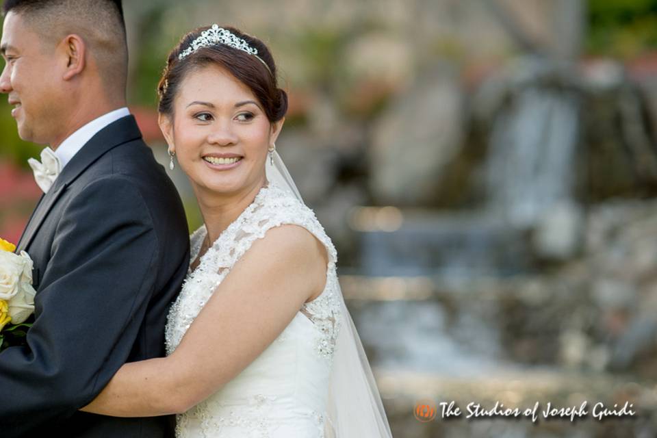 Back hugging the groom