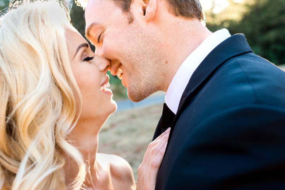 bride and groom kiss as they get married. Lake Tahoe weddings available at the Hyatt Regency lake Tahoe Resort and the Chateau at Incline Village.