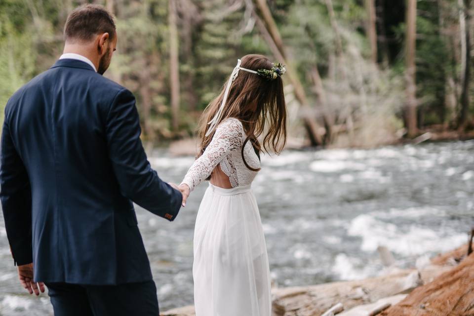 adventure wedding couple taking a hike through the forest. Lake Tahoe weddings available South lake Tahoe.