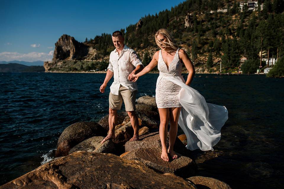 engagement session of Lake Tahoe couple on the Lake and rocks.