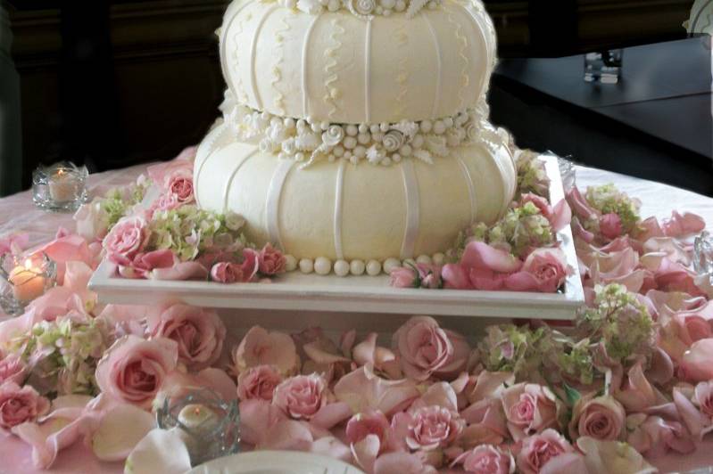 Carved wedding cake accented with custom handmade Sugarwork