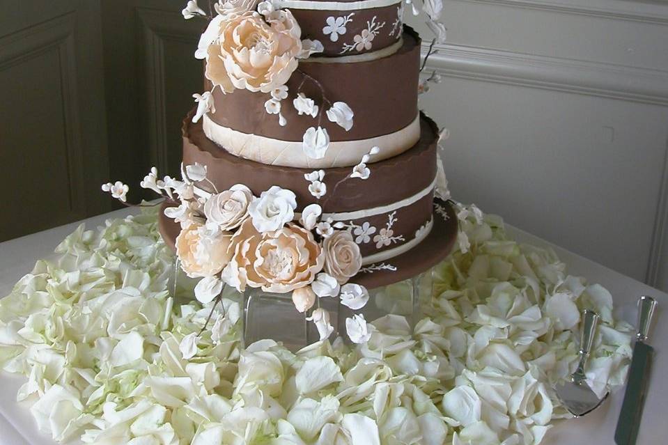 Custom designed Sugar Flowers adorn this chocolate fondant covered wedding cake