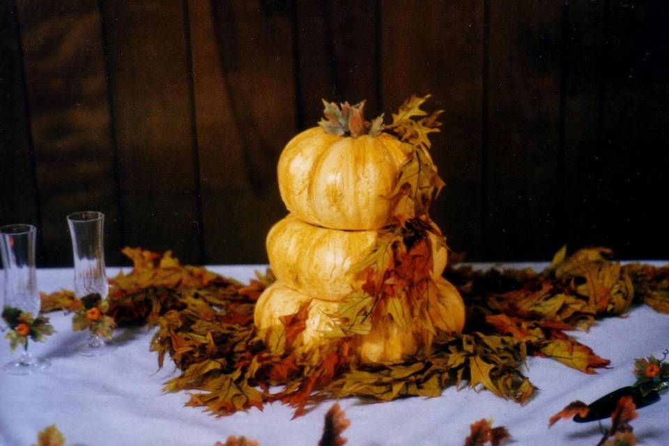 Pumpkin carved Italian Buittercream wedding c ake finished with sugar stem and leaves