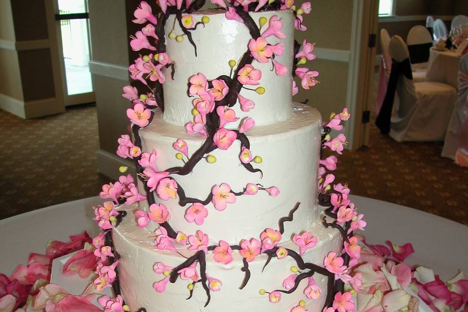 Chocolate and Sugar Cherry Blossoms decorate this Italian Buttercream wedding cake