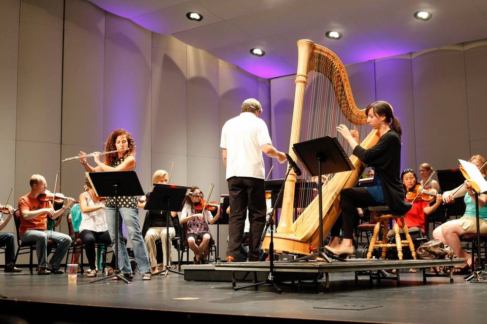 Molly Madden, rehearsing with Kim Risinger and the Heartland Festival Orchestra.