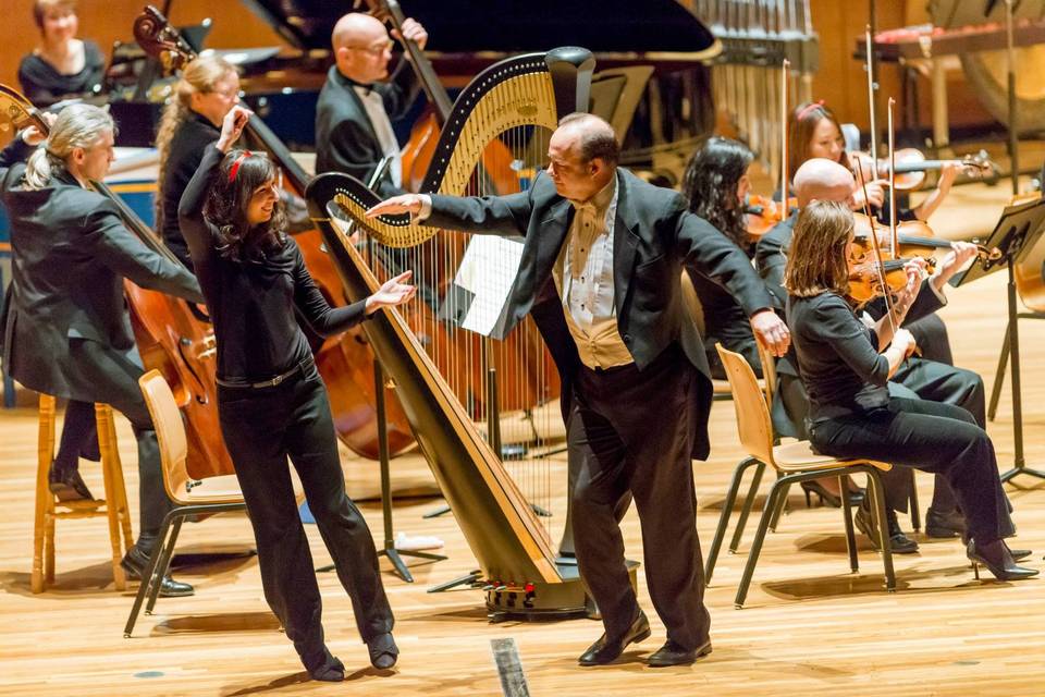 Molly Madden, dancing with Maestro Stephen Alltop during a Champaign-Urbana Symphony Christmas Concert.