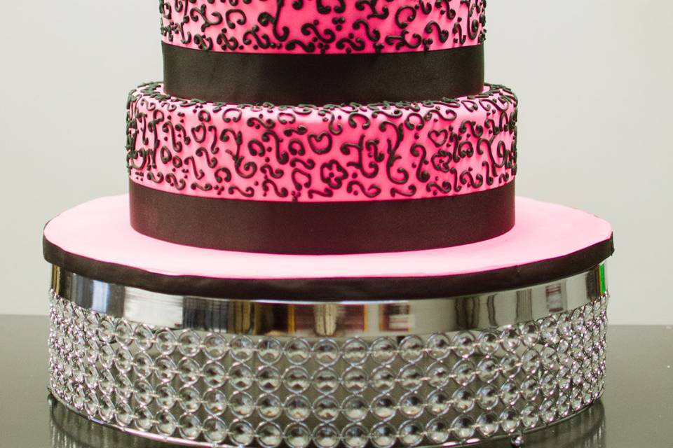 Pink 4 tier cake with blank scroll work