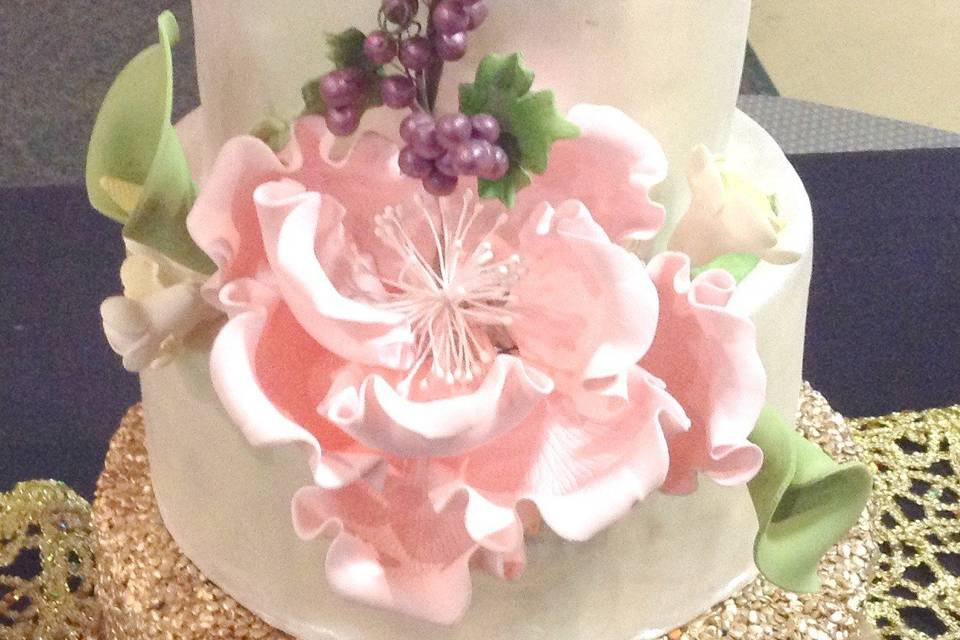 A 3 tier Nashville wedding cake covered in fondant