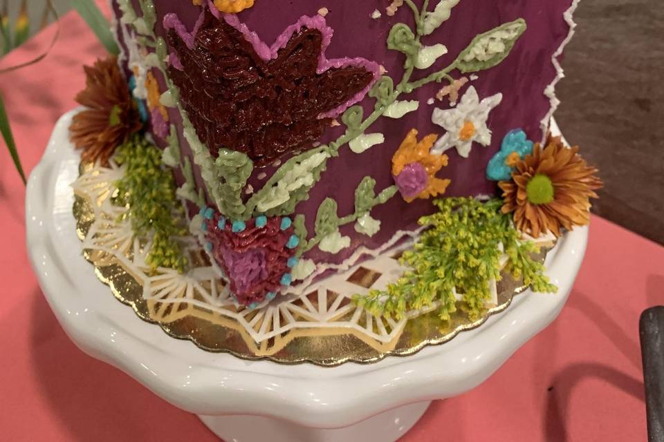 Cube cake with intricate custom design