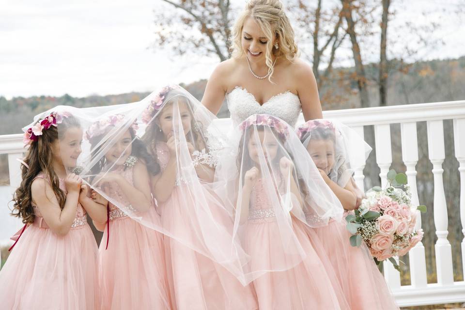 Flower girls giggling with newlywed