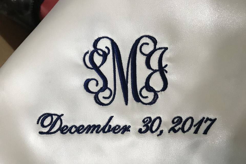 Custom embroidered monogram hand sewn inside our brides gown