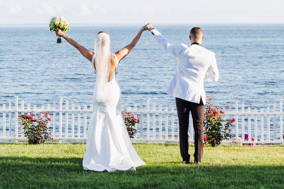 Happy couple with arms raised