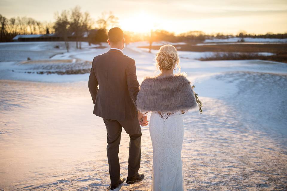 Groom and bride walking in the snow | Brian Bossany Photography
