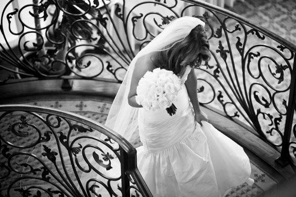 The bride walking up the staircase