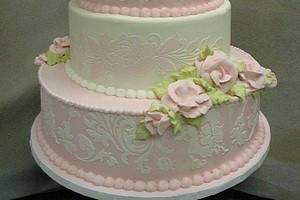 Four tiers of buttercream are also decorated entirely in buttercream.