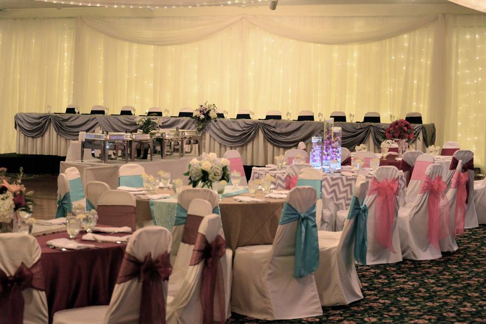 Another new addition......Hundreds of twinkle lights add a soft, warm, glow behind your head table. This upgrade will really take your wedding to the next level.
Photo courtesy of Rachel Napear Photography.