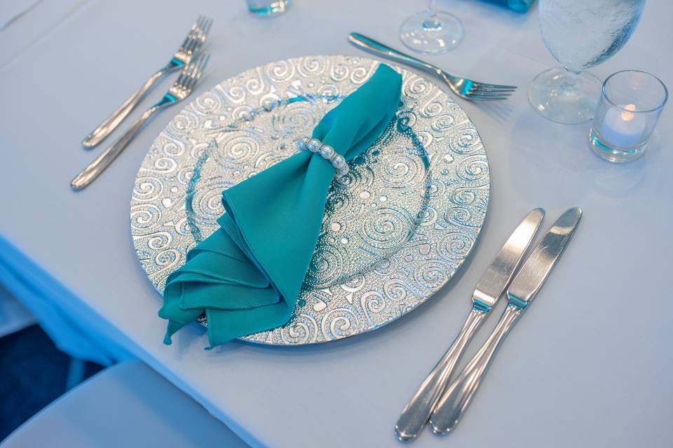 Silver charger teal napkin